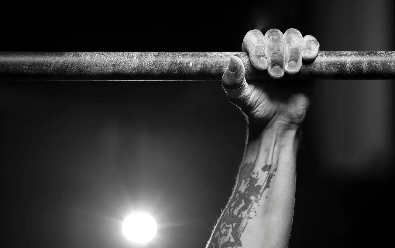 A.'s grip on a pull up bar.