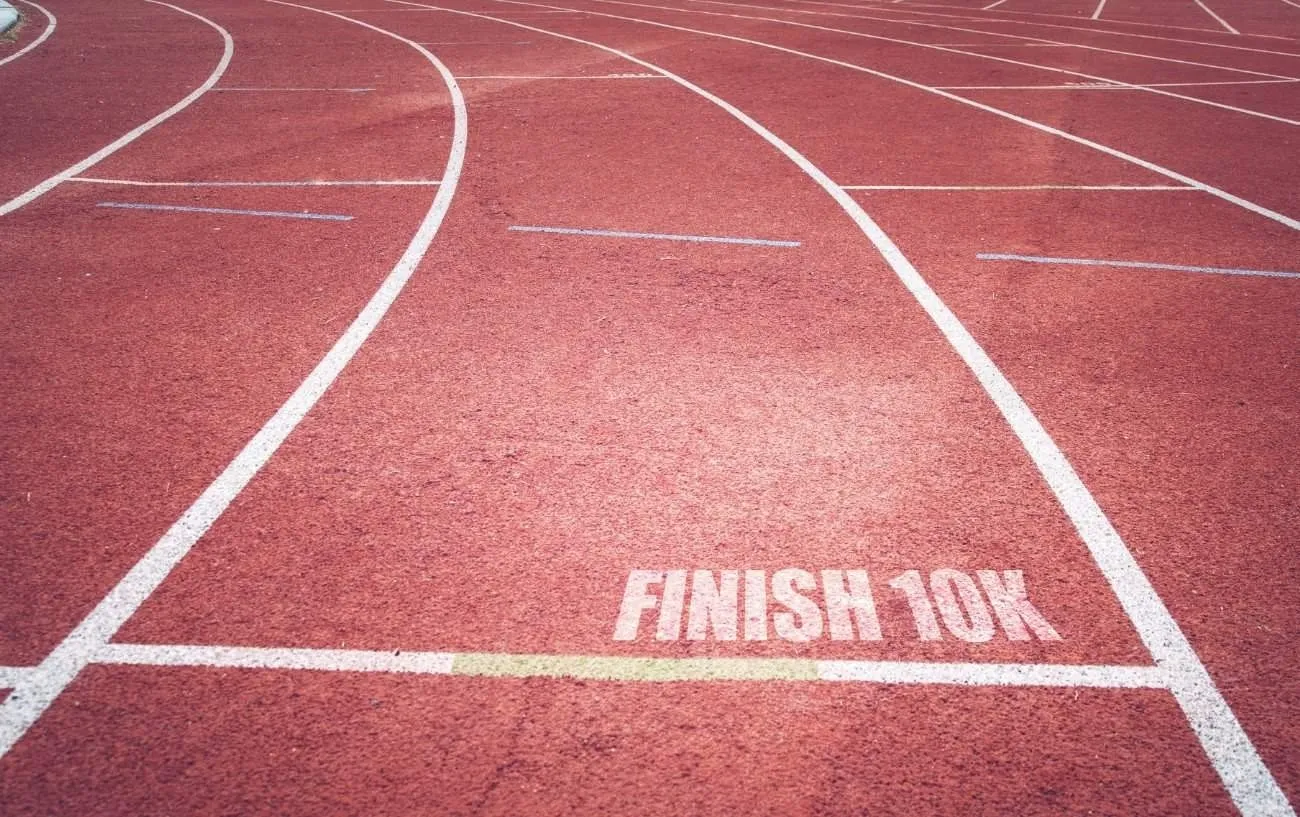 'finish 10k' written on the ground of a race track